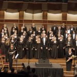 The choir and orchestra standing up